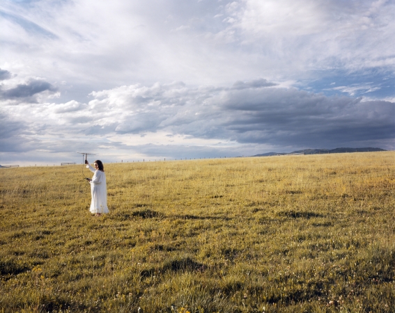Laura McPhee<br /> <em>Judy Tracking Radio-Collared Wolves From Her Yard, Summer Range, H-Hook Ranch, Custer County, Idaho, </em>2004<br /> Digital chromogenic print<br /> 30 x 40” &nbsp; &nbsp;Edition of 5<br /> 50 x 60” &nbsp; &nbsp;Edition of 5<br /> 72 x 96" &nbsp; &nbsp;Edition of 5
