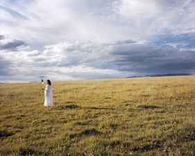 Laura McPhee<br /> <em>Judy Tracking Radio-Collared Wolves From Her Yard, Summer Range, H-Hook Ranch, Custer County, Idaho, </em>2004<br /> Digital chromogenic print<br /> 30 x 40” &nbsp; &nbsp;Edition of 5<br /> 50 x 60” &nbsp; &nbsp;Edition of 5<br /> 72 x 96" &nbsp; &nbsp;Edition of 5