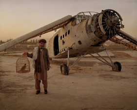 Simon Norfolk<br /> <em>Old Biplane on a display plinth at the Exhibition Grounds in Kabul, </em>2004<br /> Digital chromogenic prints<br /> 20 x 24" &nbsp; &nbsp;Edition of 10 (plus 3 APs)<br /> 40 x 50" &nbsp; &nbsp;Edition of 10 (plus 3 APs)