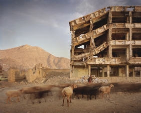 Simon Norfolk<br /> <em>Bullet scarred apartment building and shops in the Karte Char district of Kabul, </em>2003<br /> Digital chromogenic prints<br /> 20 x 24" &nbsp; Edition of 10 (plus 3 APs)<br /> 40 x 50" &nbsp; Edition of 10 (plus 3 APs)